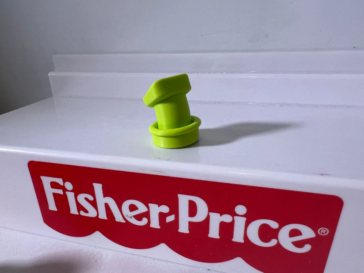 Neon green goofy hat accessory with curled brim on white shelf