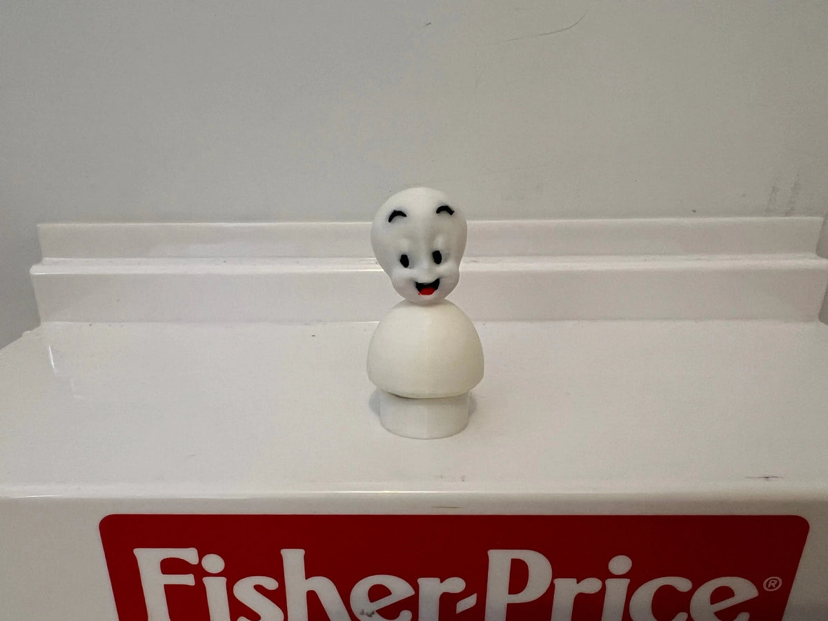 White Casper the Friendly Ghost figurine with rounded head and smiling face.