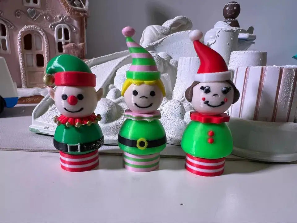 Three custom 3D printed Fisher-Price Little People Christmas figures