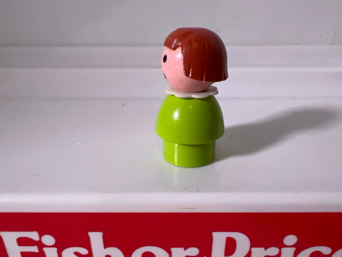 Lime green girl figure with red bob hair, side profile