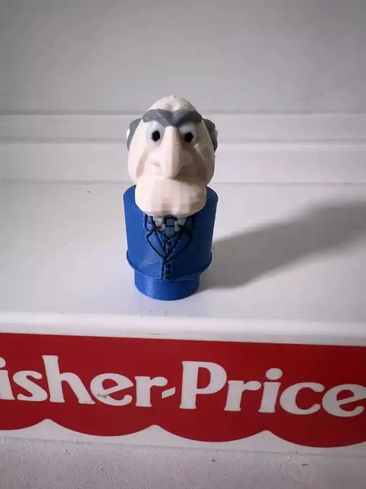 A 3D printed custom Fisher-Price Little People figure of Muppets character Statler in a blue suit