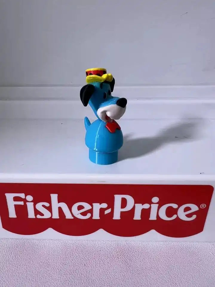 Huckleberry Hound blue figurine with yellow hat and red scarf, side view