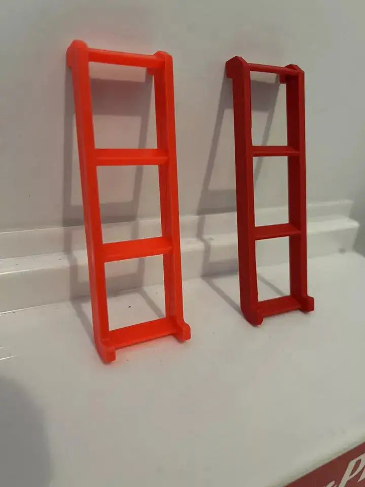 Pair of freestanding plastic replacement ladders, orange and red, three rungs each