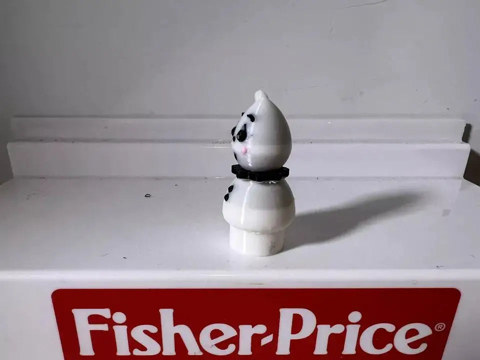 A custom 3D printed Fisher-Price Little People Halloween Spooky figure, black and white with an orange neckband