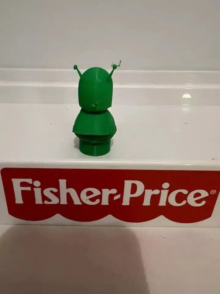 Green Great Gazoo character figure, back view with antennae, toy