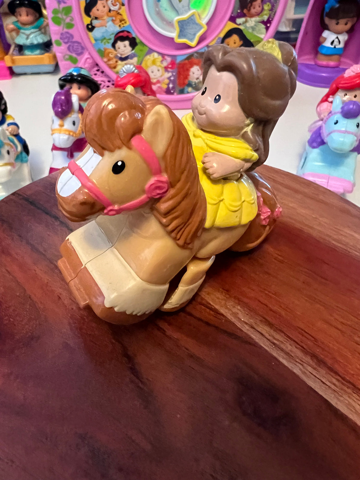 Little People rider figure with brown hair on tan horse, molded toy