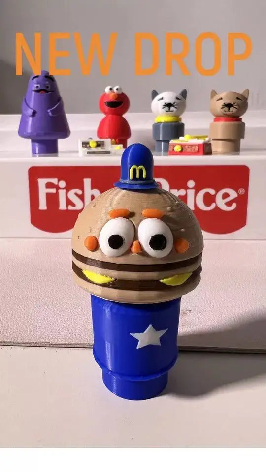 Custom Fisher-Price style Officer Big Mac figure in a blue hat and base, with other Little People style figures in the background
