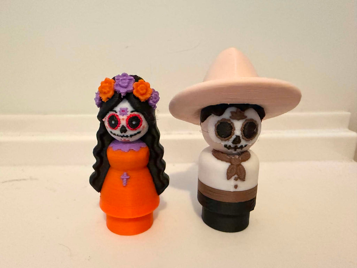 Day of the Dead figurines set: Catrina-style girl and skeleton man in hat
