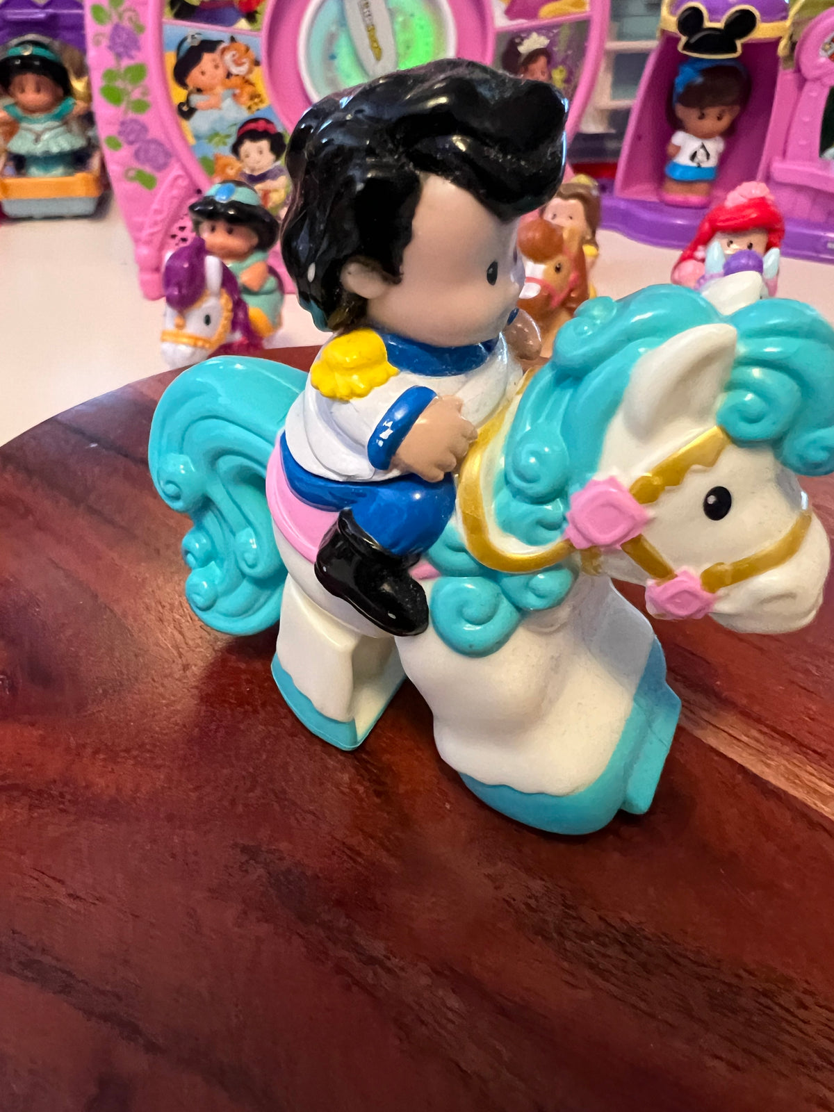 Little People Belle-style rider with black hair on teal horse, molded toy