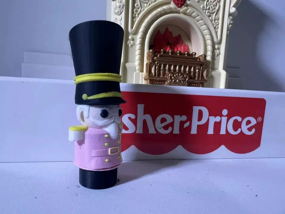 Nutcracker figurine with black top hat, green bands, purple coat and white face