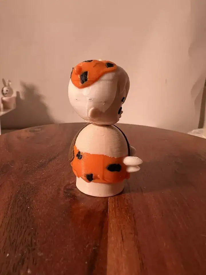 Bam Bam collectible figure front view in white with orange-and-black spots, holding club