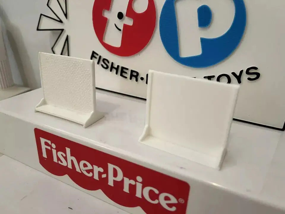 Two white hospital privacy screens standing upright on a display
