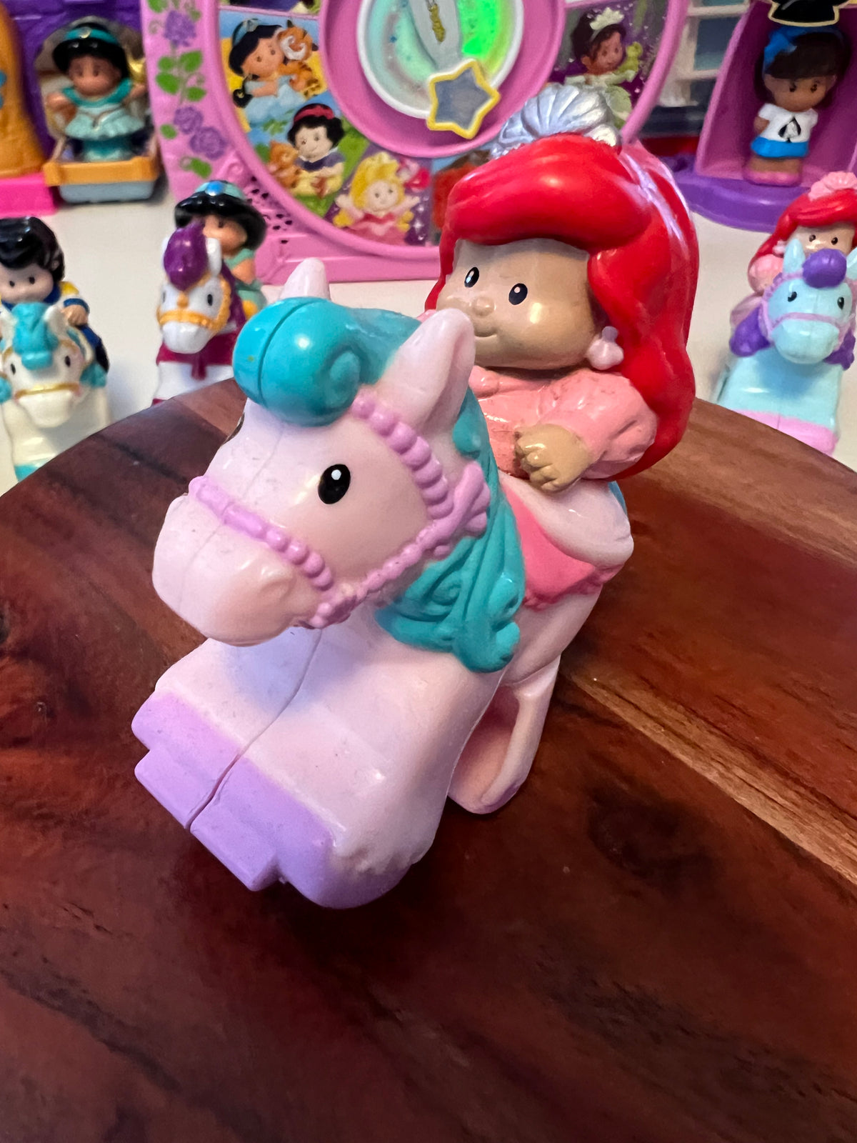 Little People Ariel-style rider with red hair on teal horse, molded toy