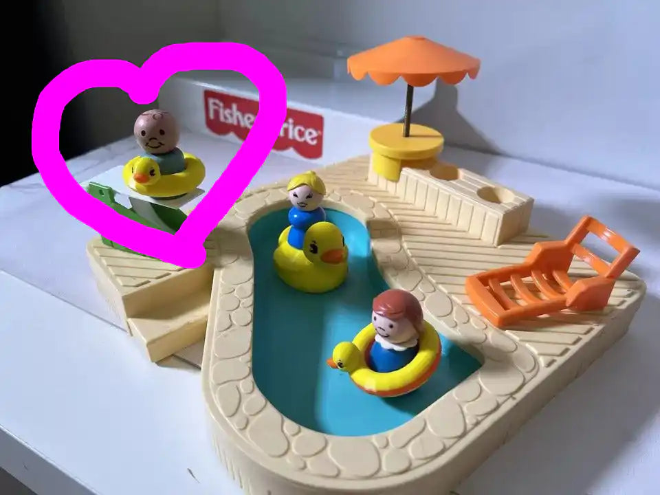 Toy mini duck floatie with yellow duck and child figures in blue circular pool