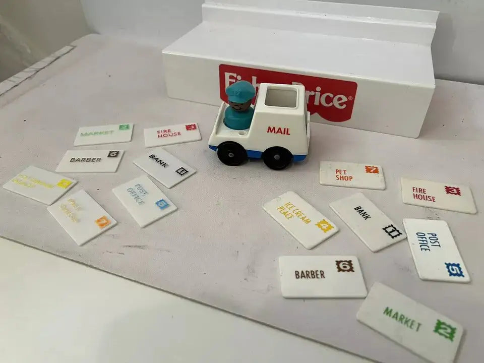 Fisher-Price mail truck with replacement address cards for Bank, Market, Pet Shop, Fire House, and others