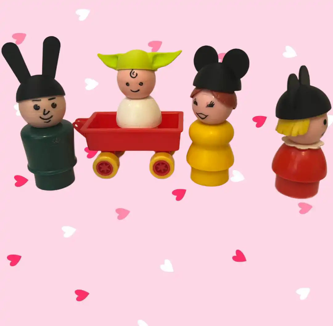 Custom Grogu hat on a Little People vintage-style figure in a red wagon, with Mickey Mouse and bunny figures.