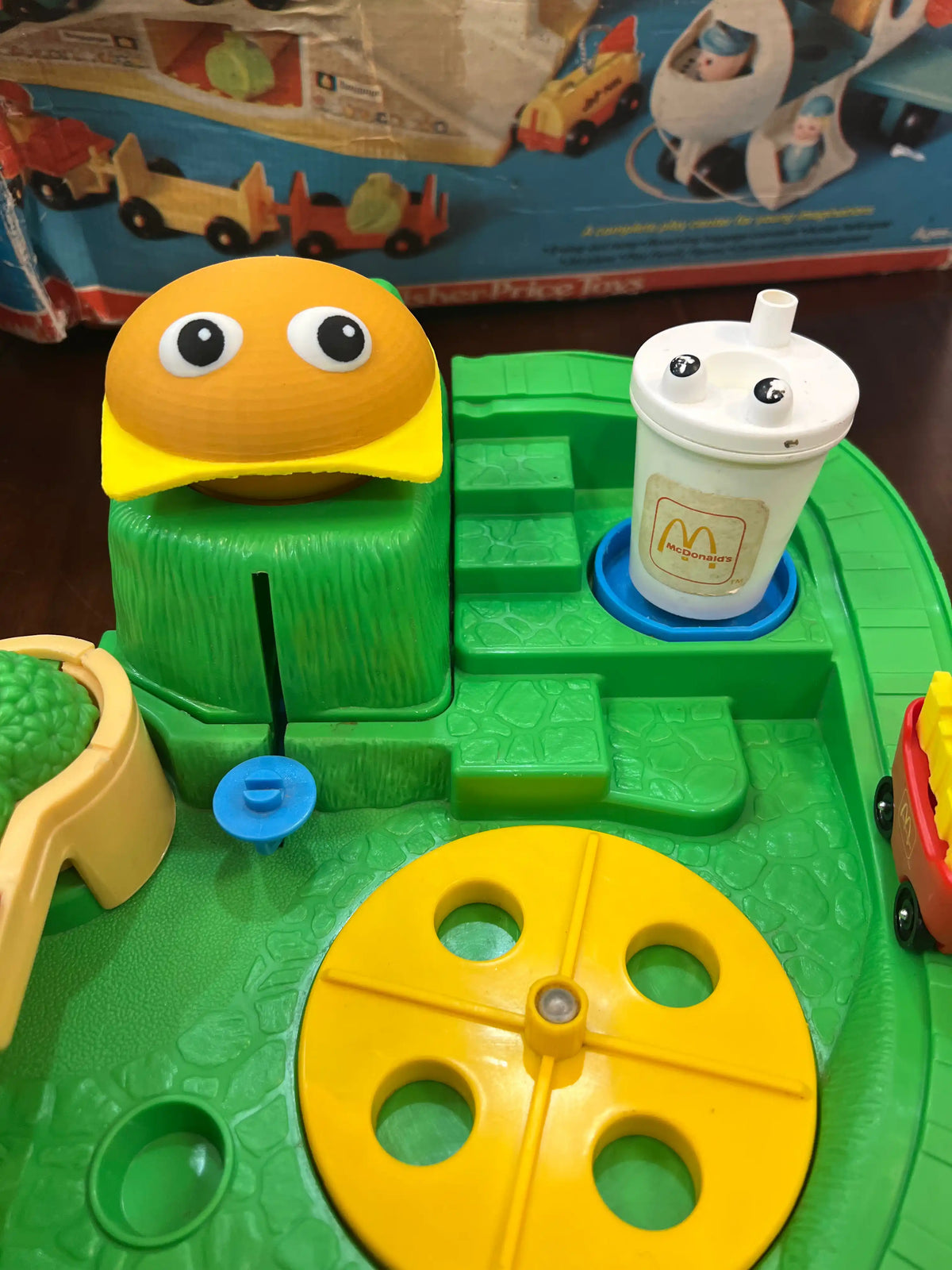 A custom 3D printed replacement burger top with eyes on a vintage Fisher-Price McDonald's Restaurant playset.