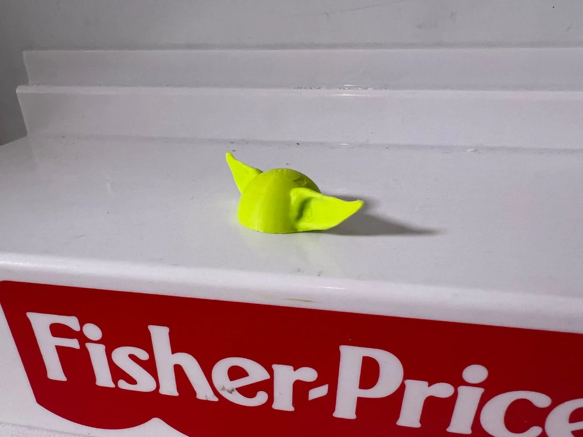 Lime-green folded hat with pointed crown