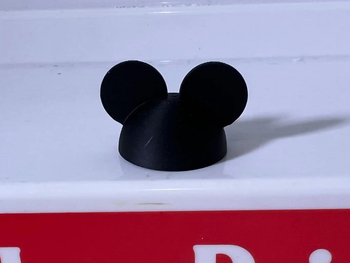 A custom 3D printed miniature black Mickey hat accessory for Little People Vintage Style figures