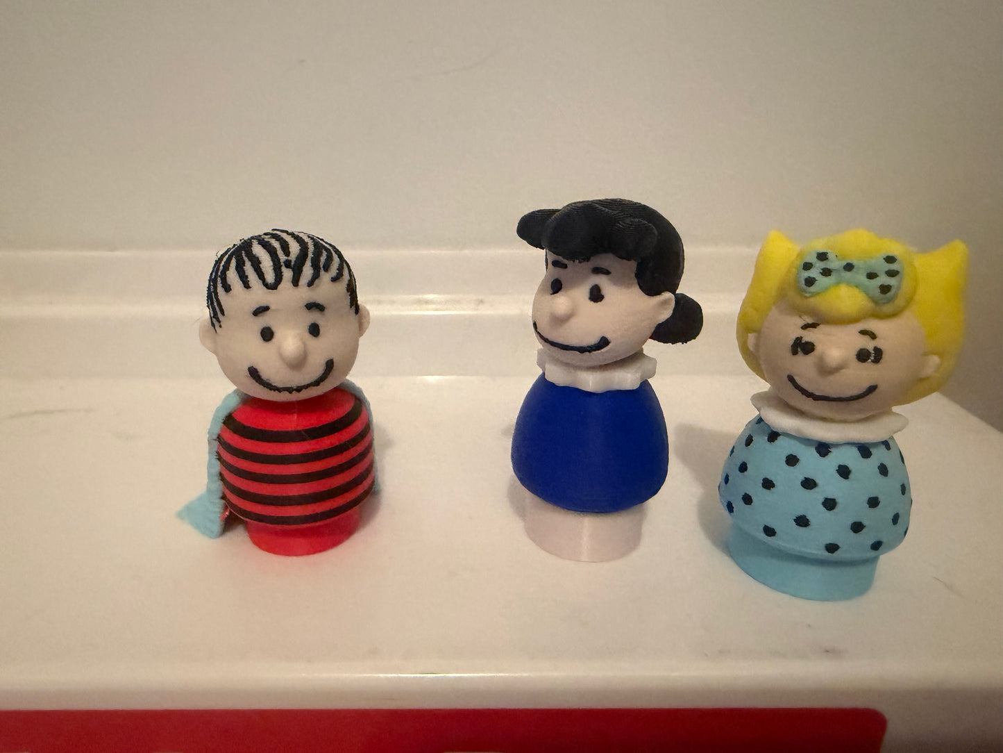3D Linus collectible figure, front view, with striped shirt and blue blanket