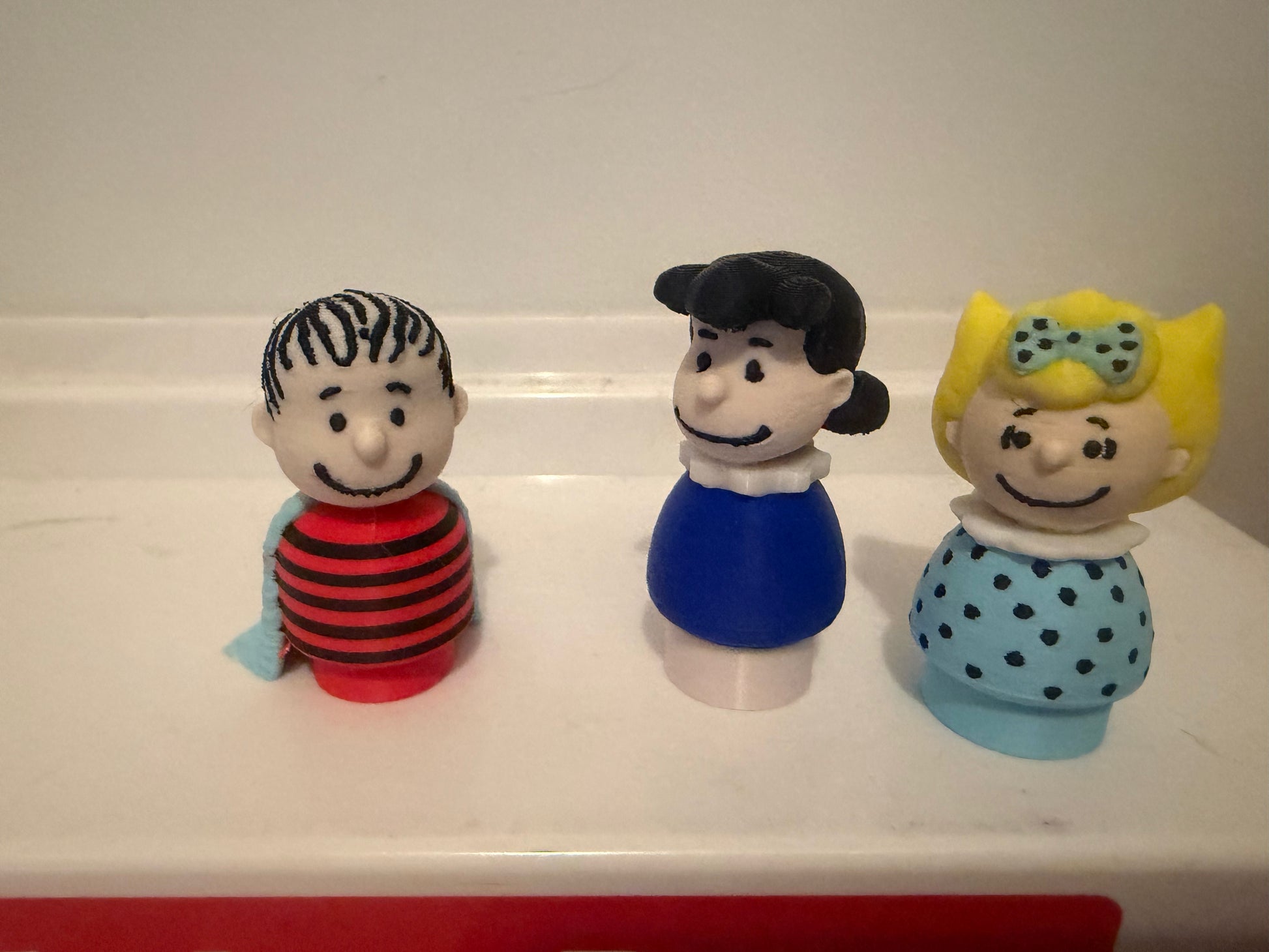 3D Linus collectible figure, front view, with striped shirt and blue blanket