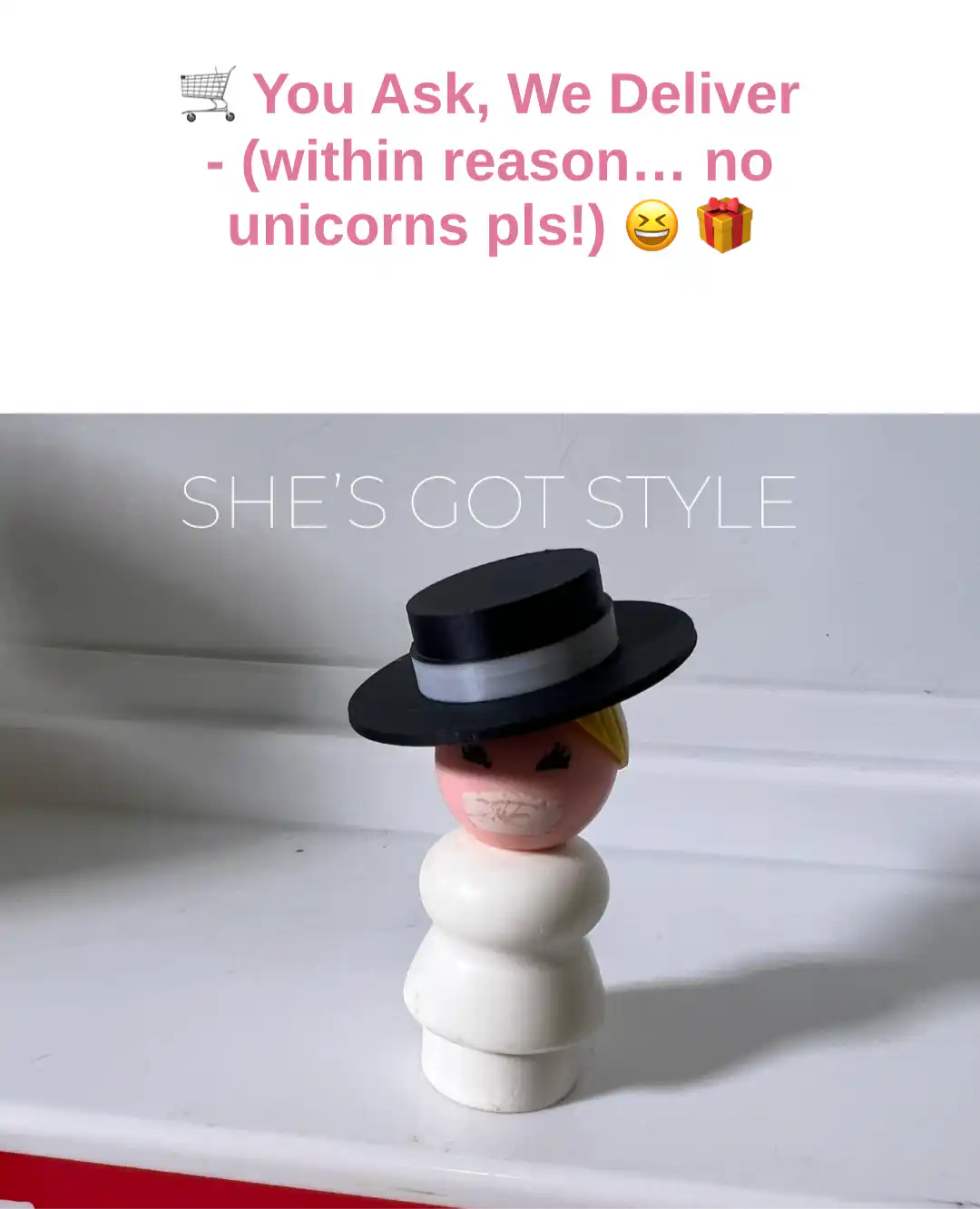 Vintage Fisher-Price figure wearing a black top hat on a white body