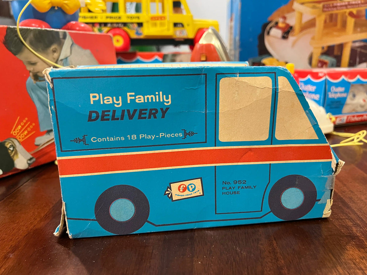 Blue play delivery van toy box with red trim and large side window