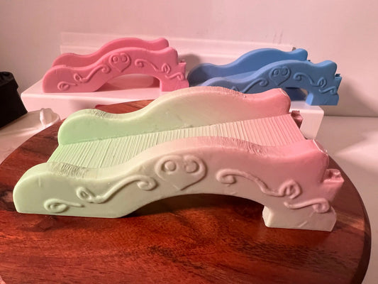 Pastel toy castle ramp piece with molded details, pale green and white
