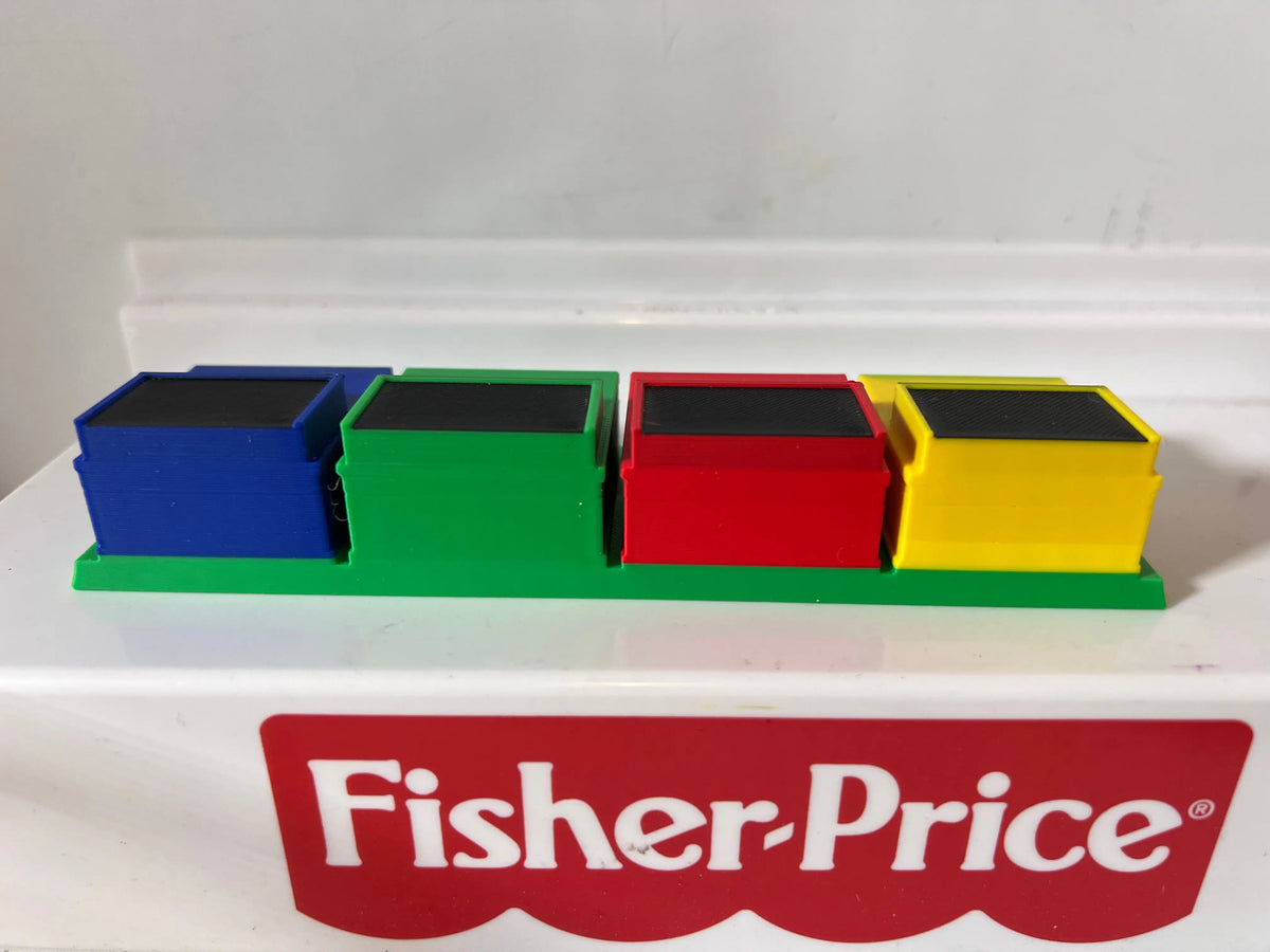 Three-color game show podium row with blue, green, red, and yellow blocks
