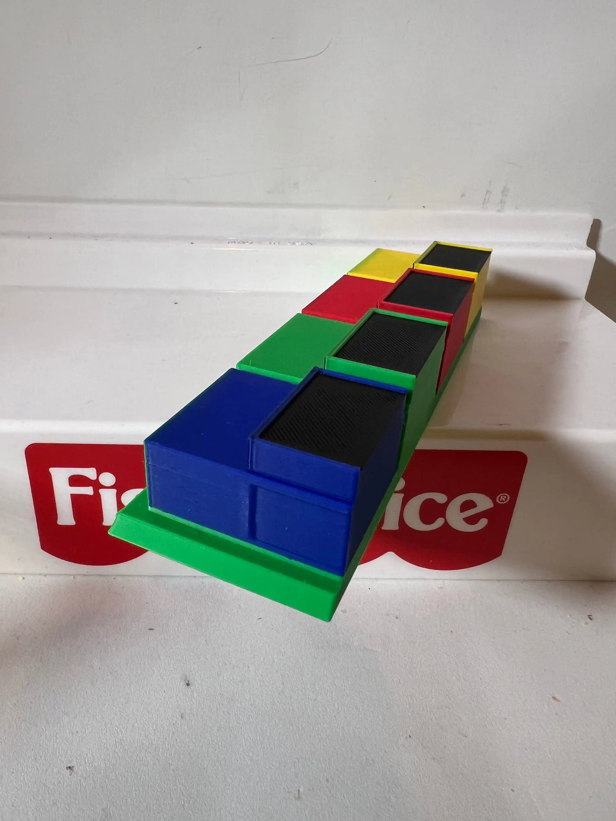 Colorful podium blocks arranged in a row for a game show display