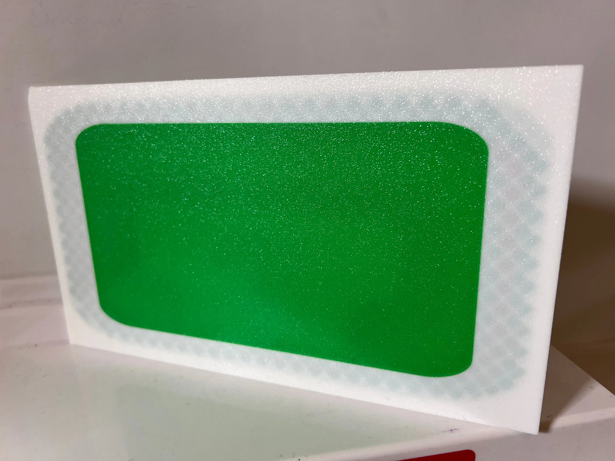 Green rectangular insert on a white game show backdrop panel