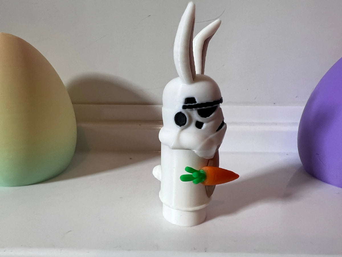Storm Trooper bunny figure with black goggles and orange carrot in front