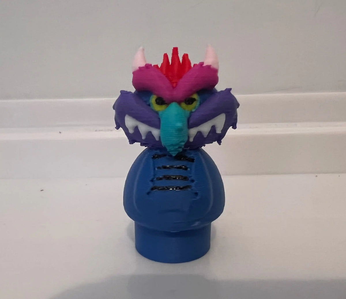 A custom 3D printed "My Pet Monster" figure in blue and purple, designed in the style of Fisher-Price Little People.