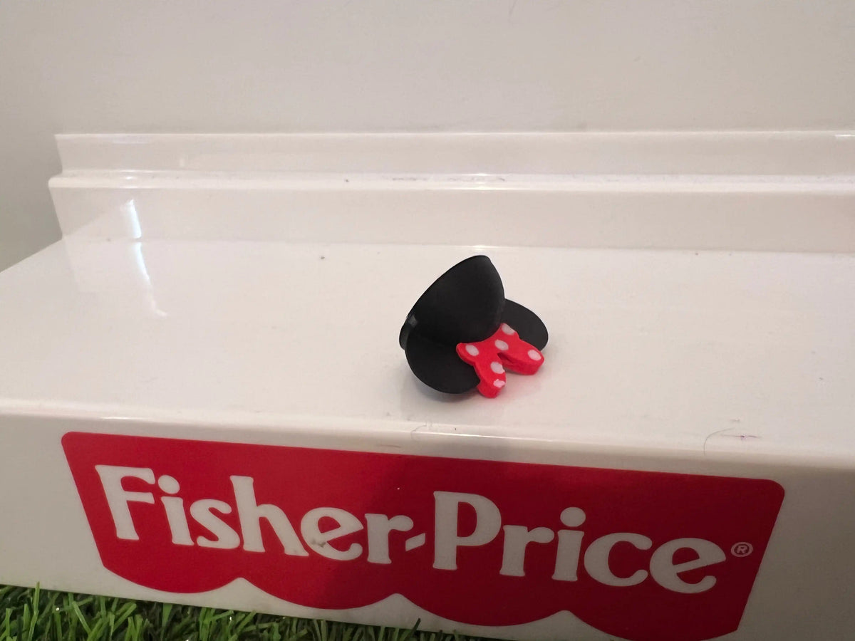 Black Minnie-style mouse ear hat with red bow detail