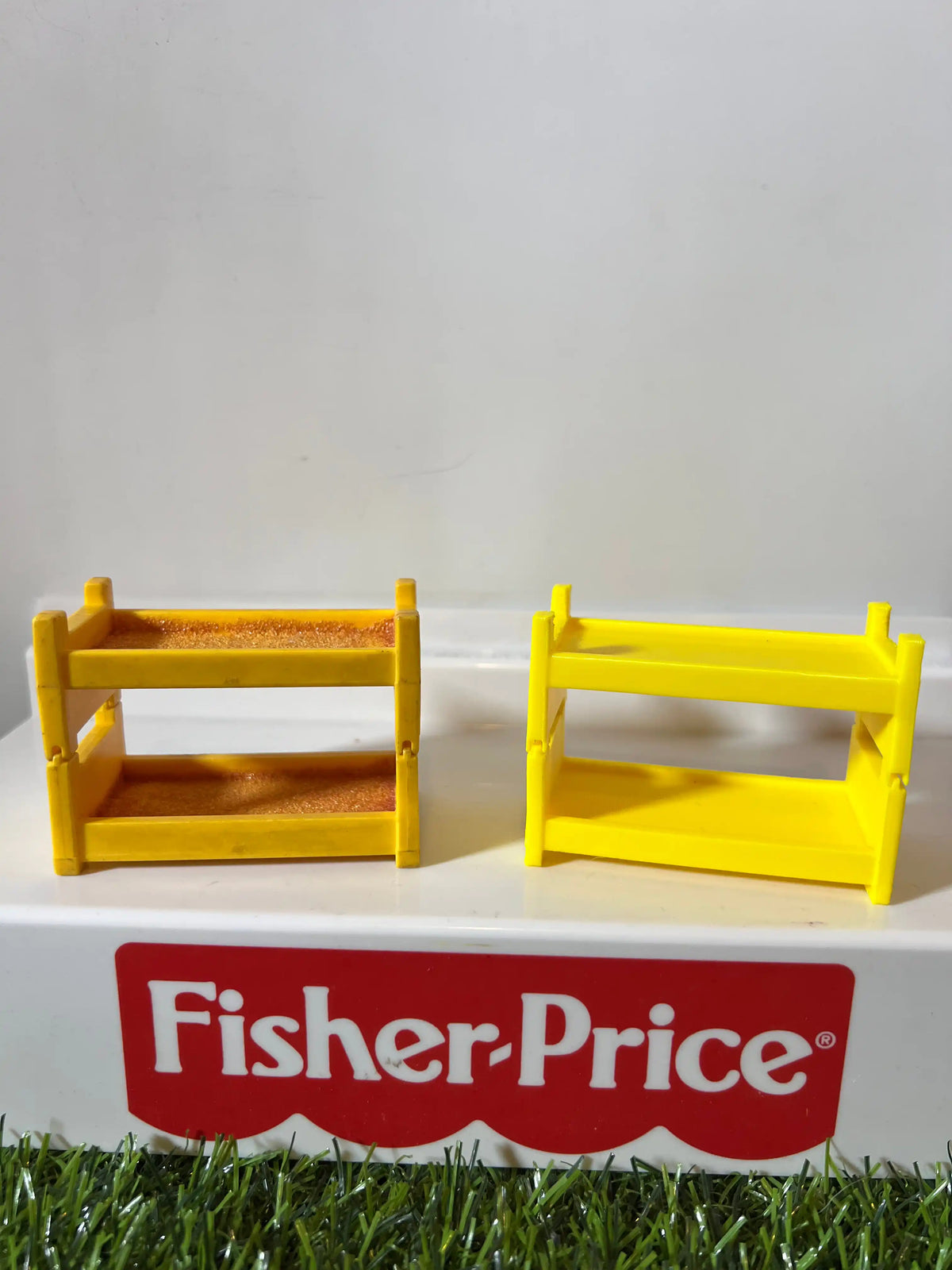 Two yellow plastic bunk bed frame replacements with side rails and horizontal bars
