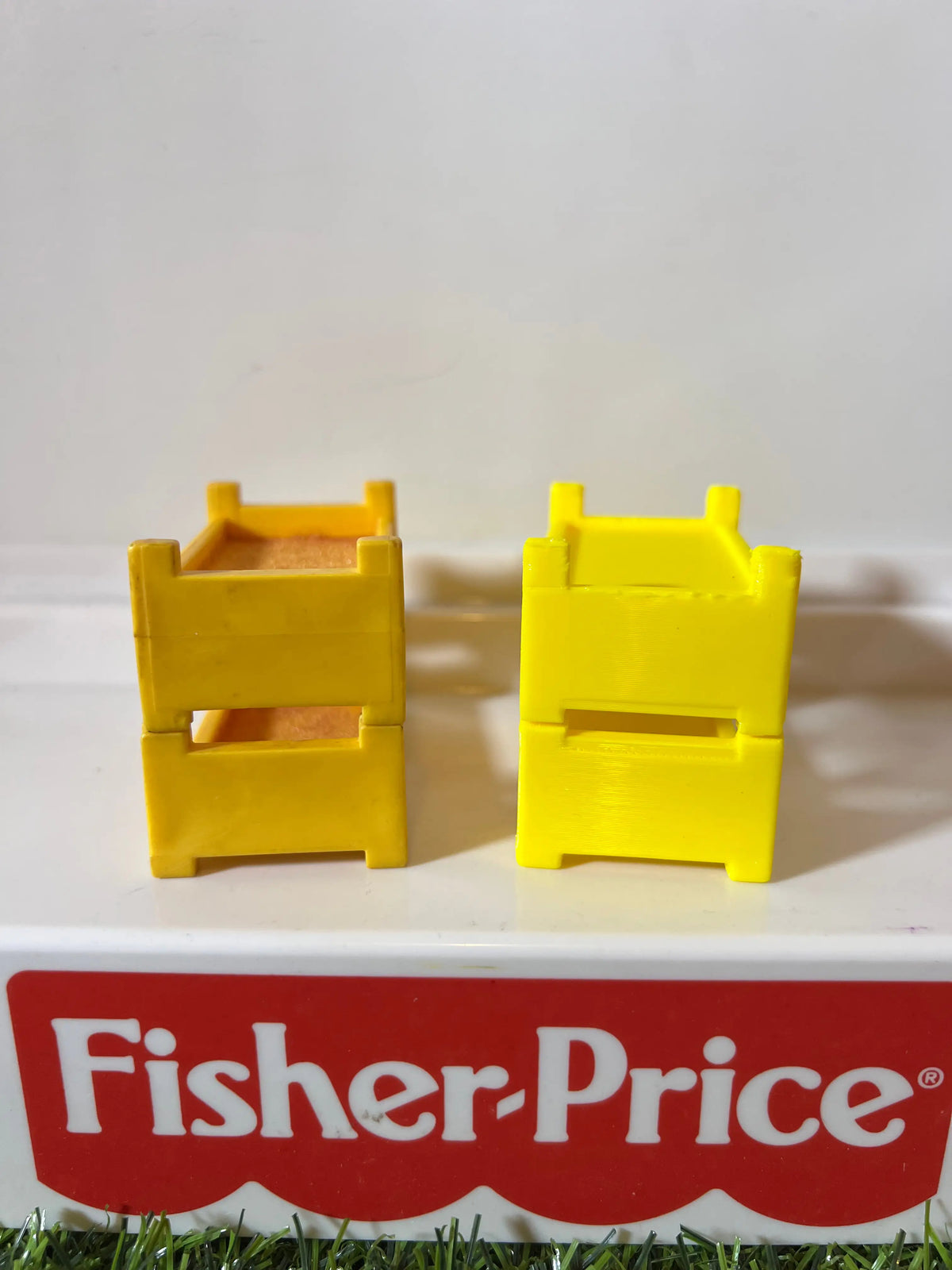 Pair of yellow plastic bunk bed frame replacements, end views