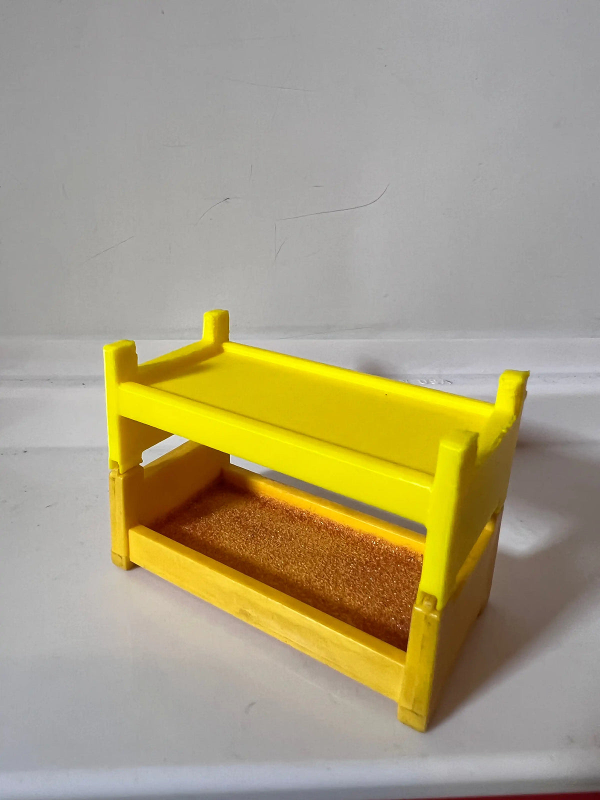Yellow plastic bunk bed frame replacement with brown insert platform and guard rails