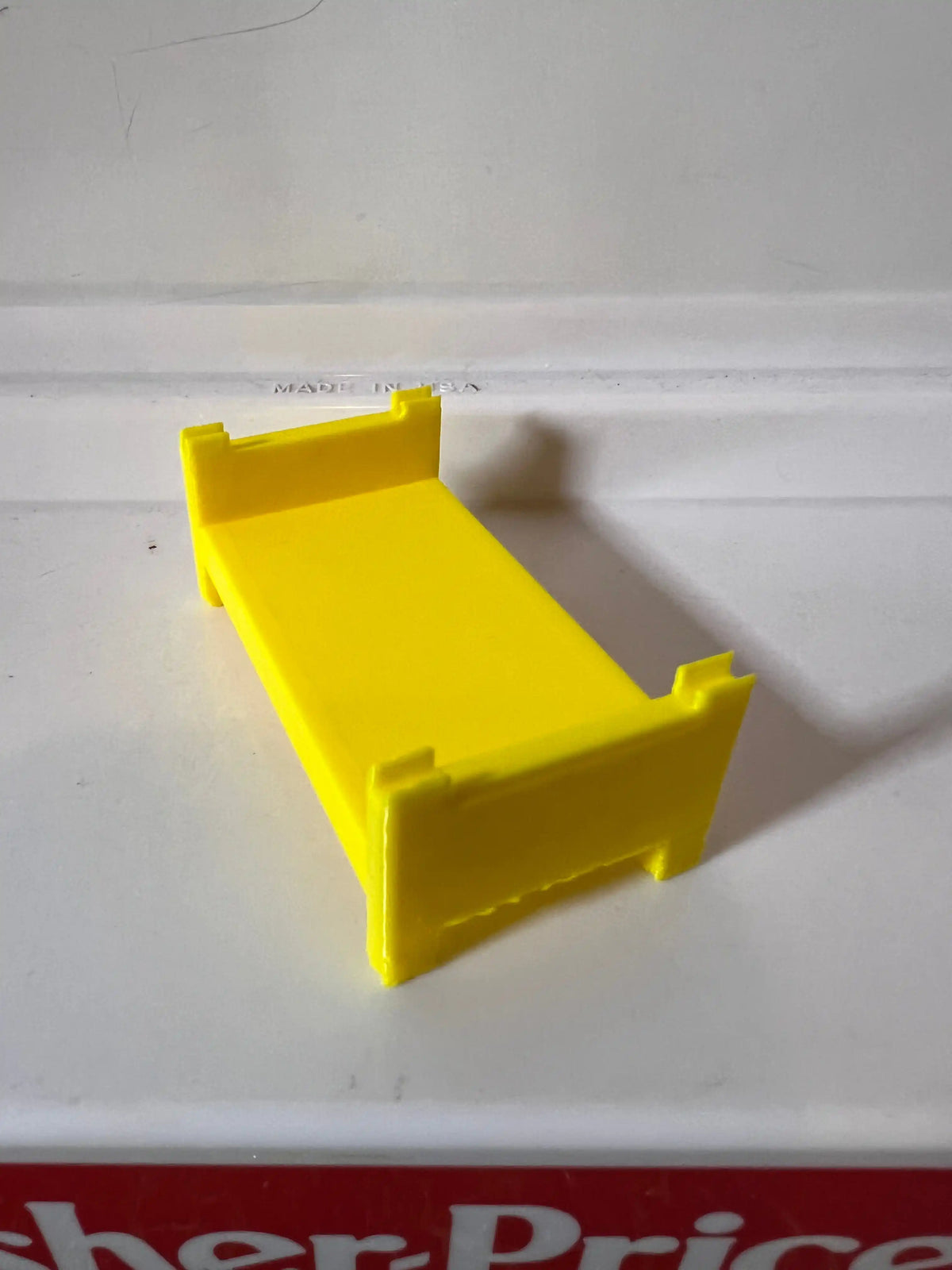 Yellow plastic bunk bed frame replacement with slanted platform and side posts