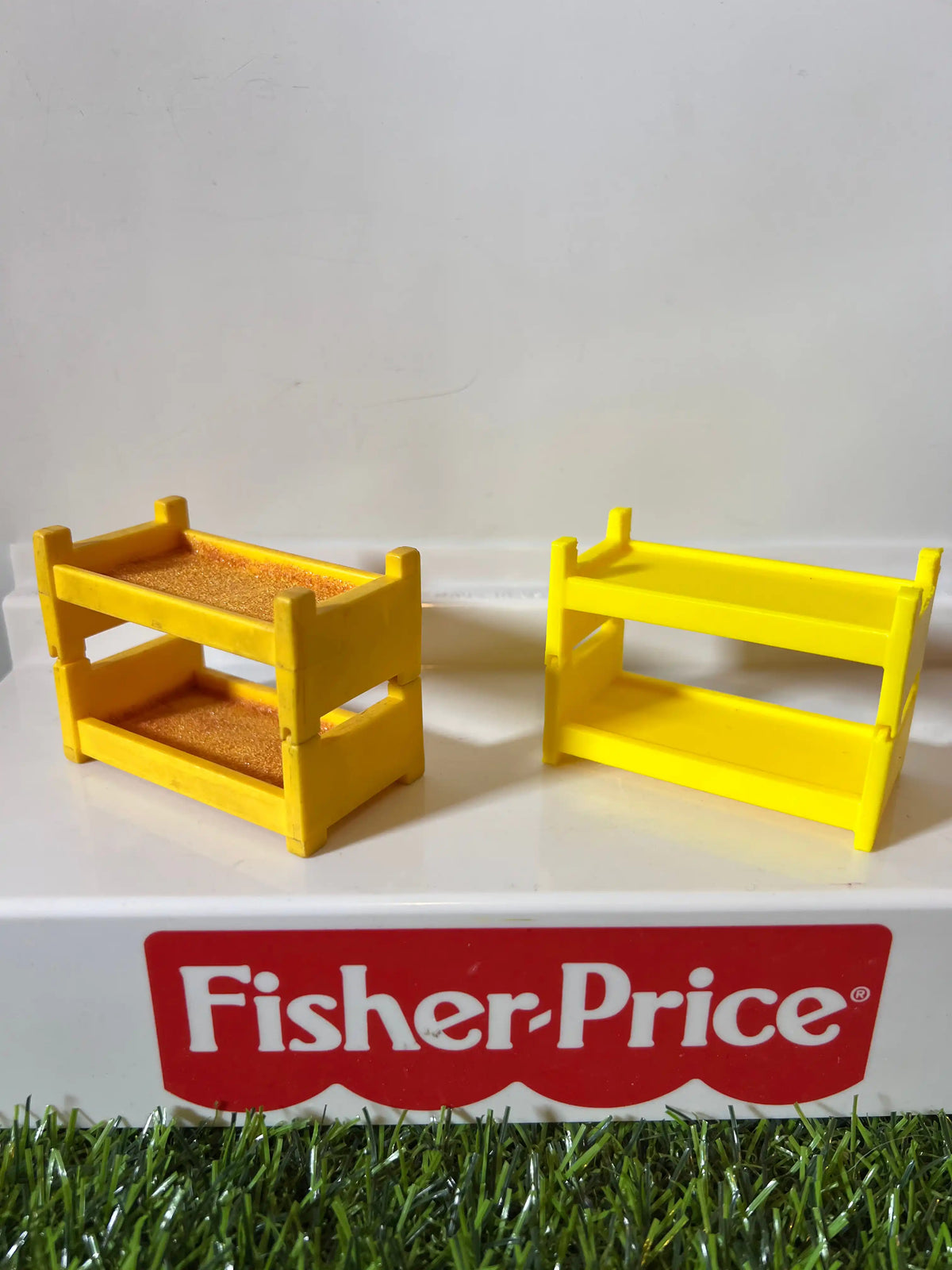 Two yellow plastic bunk bed frame replacements with side rails and horizontal bars