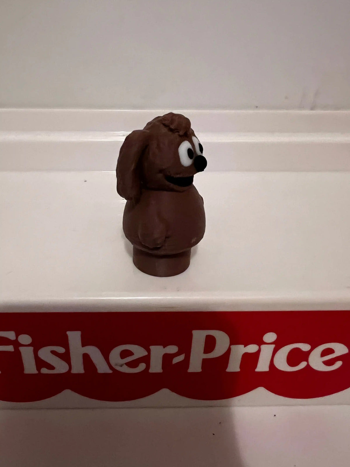 Rowlf brown plush dog figurine, sitting with floppy ears and white belly