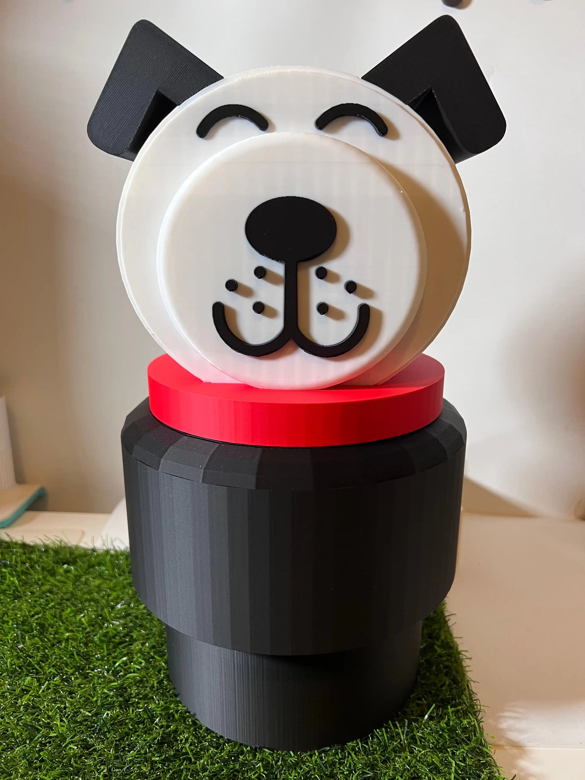 Jumbo dog stacking toy with centered dog face, black ears, red collar, dark base