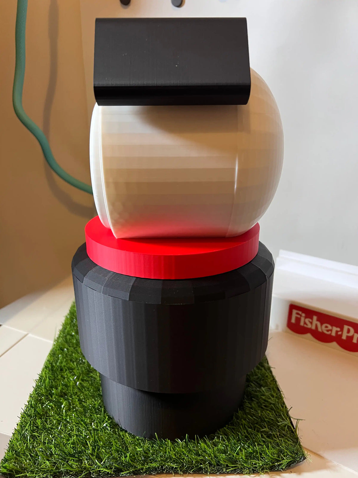 Jumbo dog stacking toy with cream top, red ring collar, dark base, black rear ears