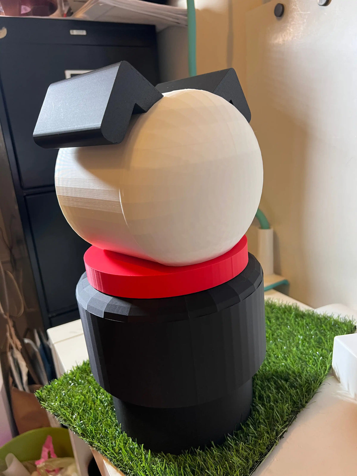 Jumbo dog stacking toy with cream dome top, black ears, red collar, dark base