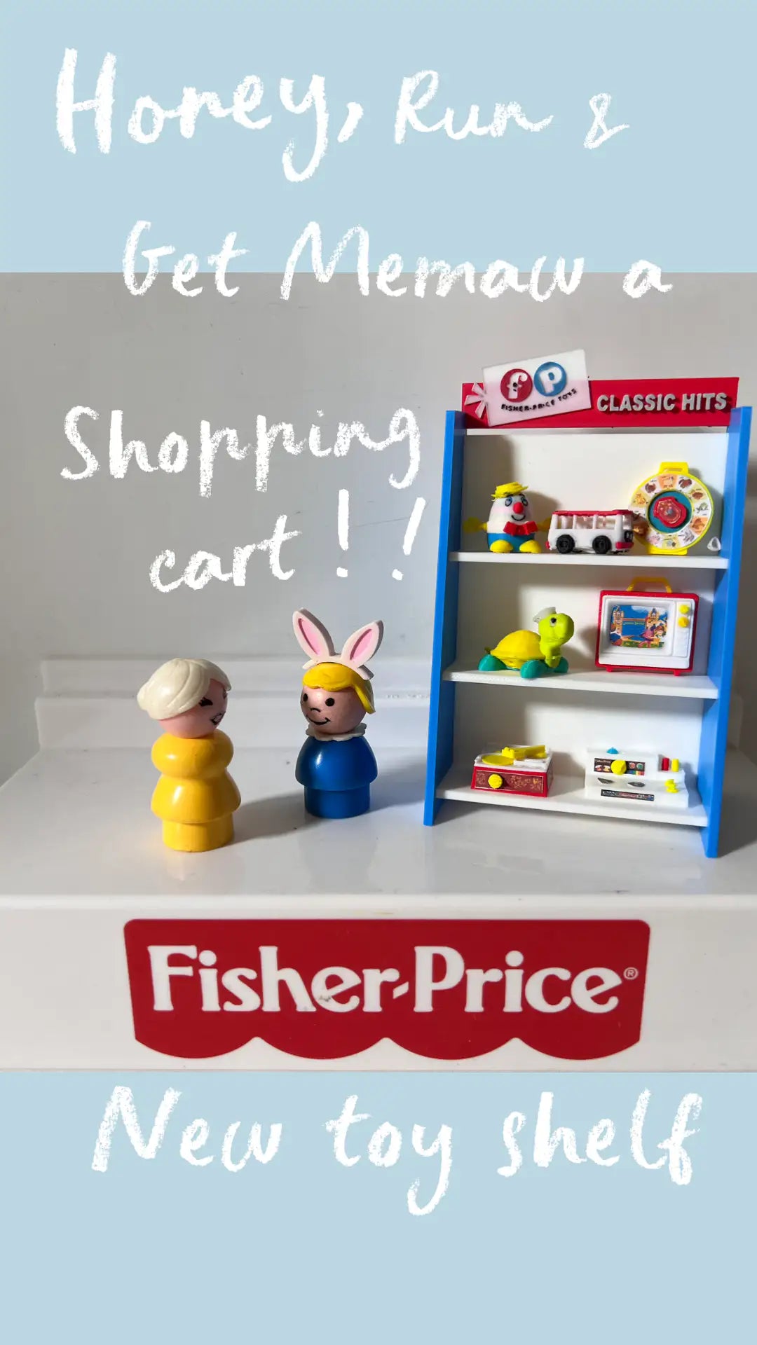 Blue toy shelf with white shelves and red top, Fisher-Price branding