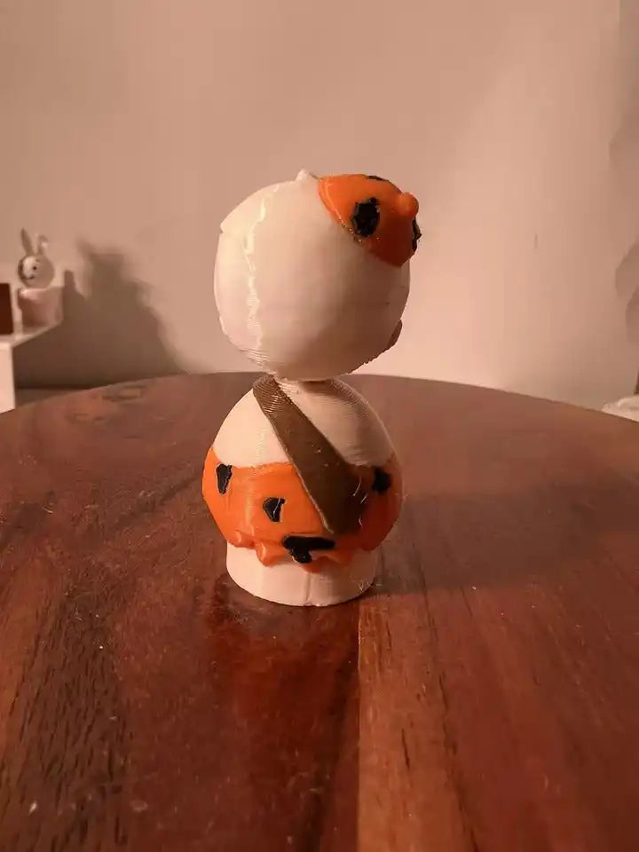 Bam Bam collectible figure back view in white with orange hair, holding orange club