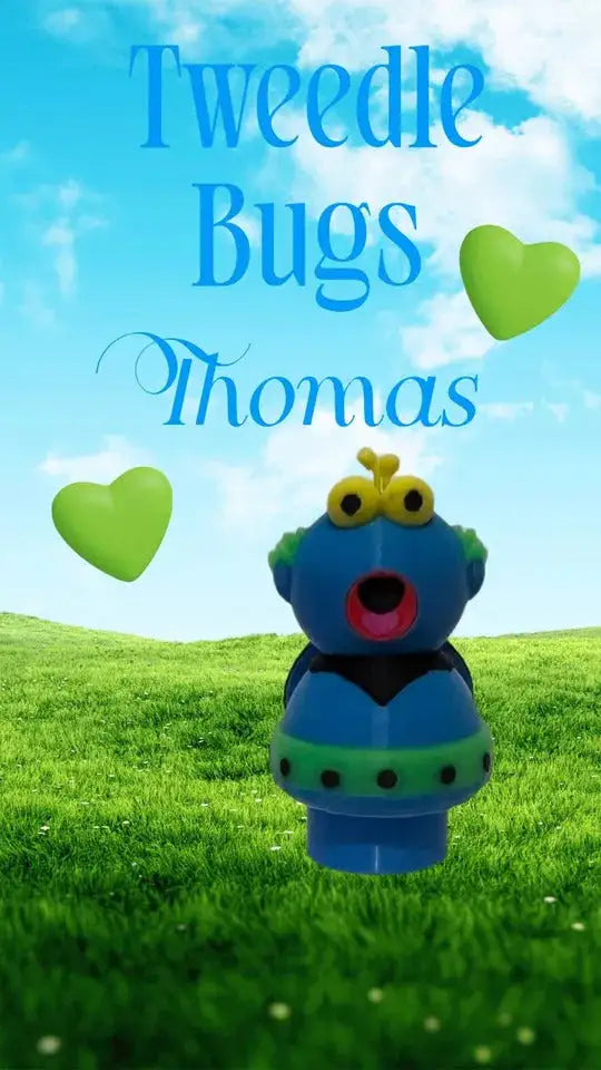 A custom Little People style figure of a blue "Tweedle Bug Thomas" character with green accents, set against a grassy field and blue sky, with text "Tweedle Bugs Thomas" and two green hearts.