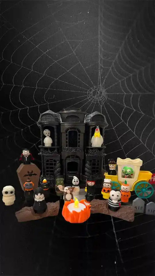 Small brown-and-white dog-themed toy figurines with mini haunted house set