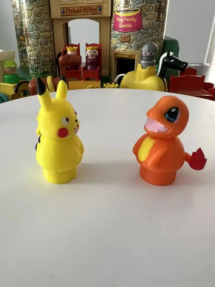 Charmander toy figurine, orange body with blue eyes, red arms and legs, angled right.