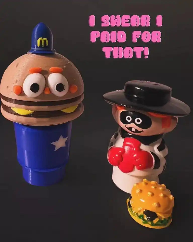 A custom McDonald's Officer Big Mac Little People style figure investigates a hamburger theft