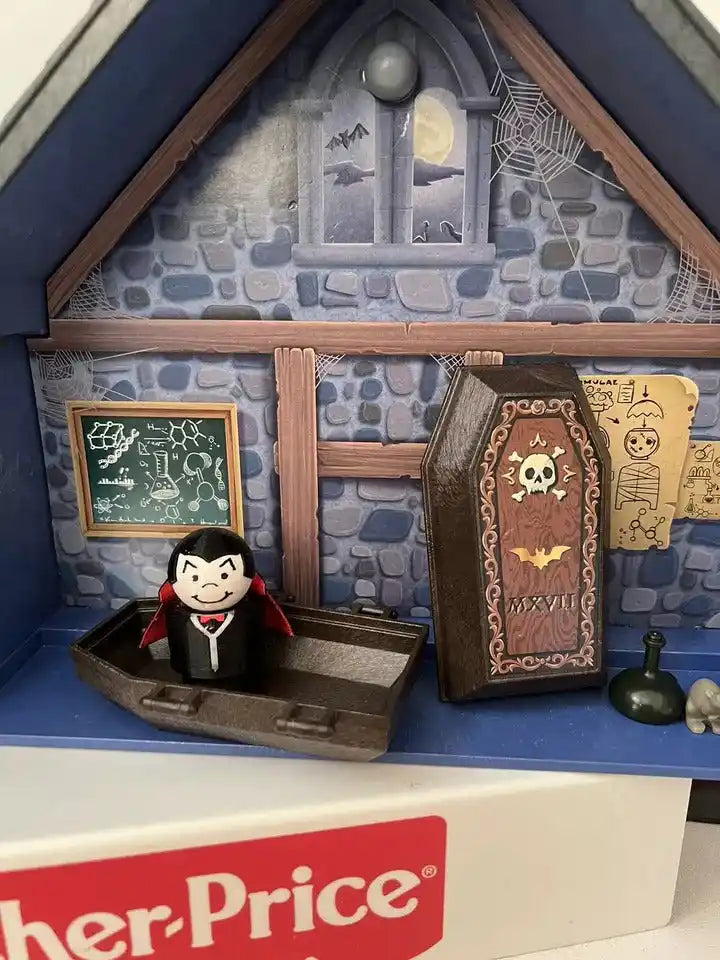 Dracula-style vampire figure in black with red cape beside coffin and framed portraits.